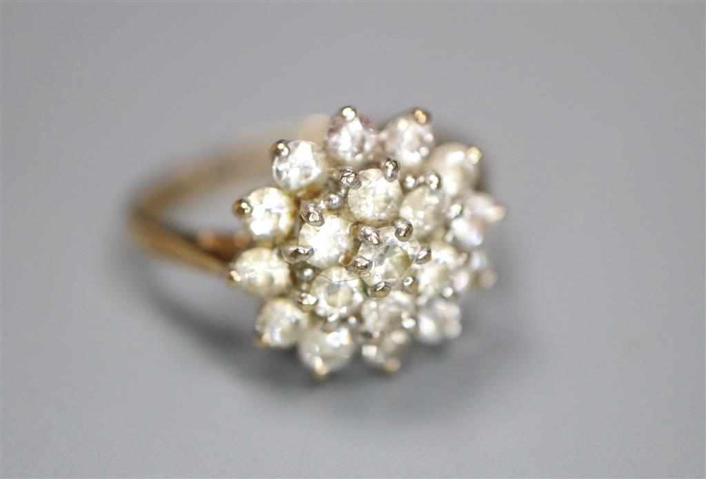 A modern 9ct gold and cubic zirconia cluster set dress ring, size J, gross 2.3 grams.